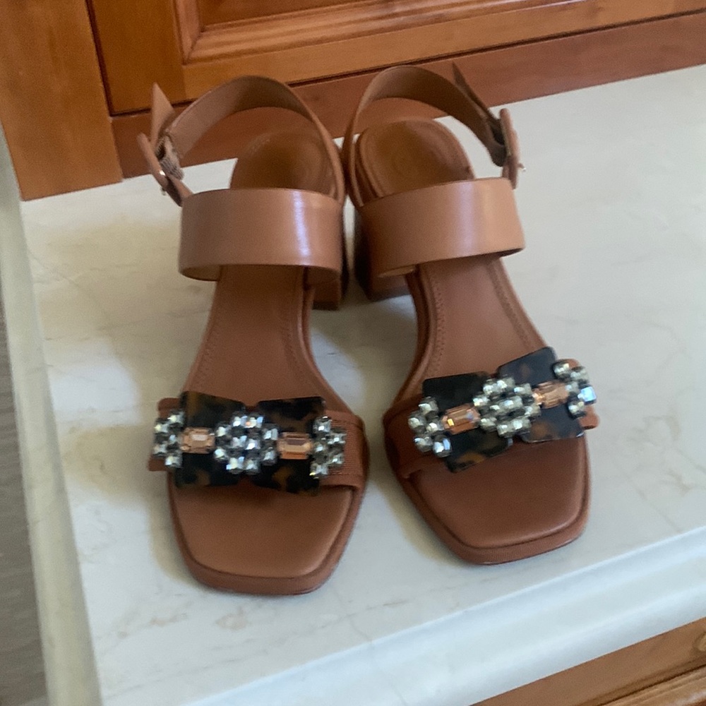 Tory Burch sandals with a rhinestone and tortoise ornament. Worn once, Like new.